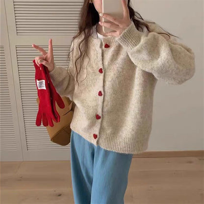 Dames pull-over tricot doux avec boutons en forme de cœur Chic und Stil