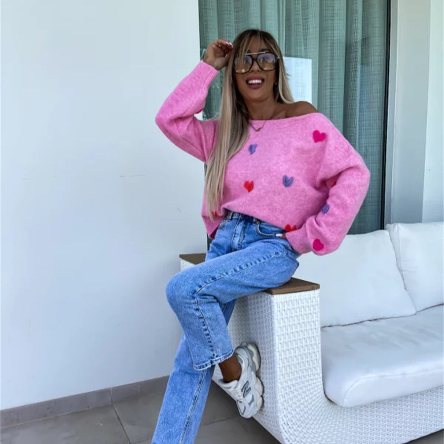 Pull femme avec des cœurs ludiques et une coupe décontractée Chic und Stil