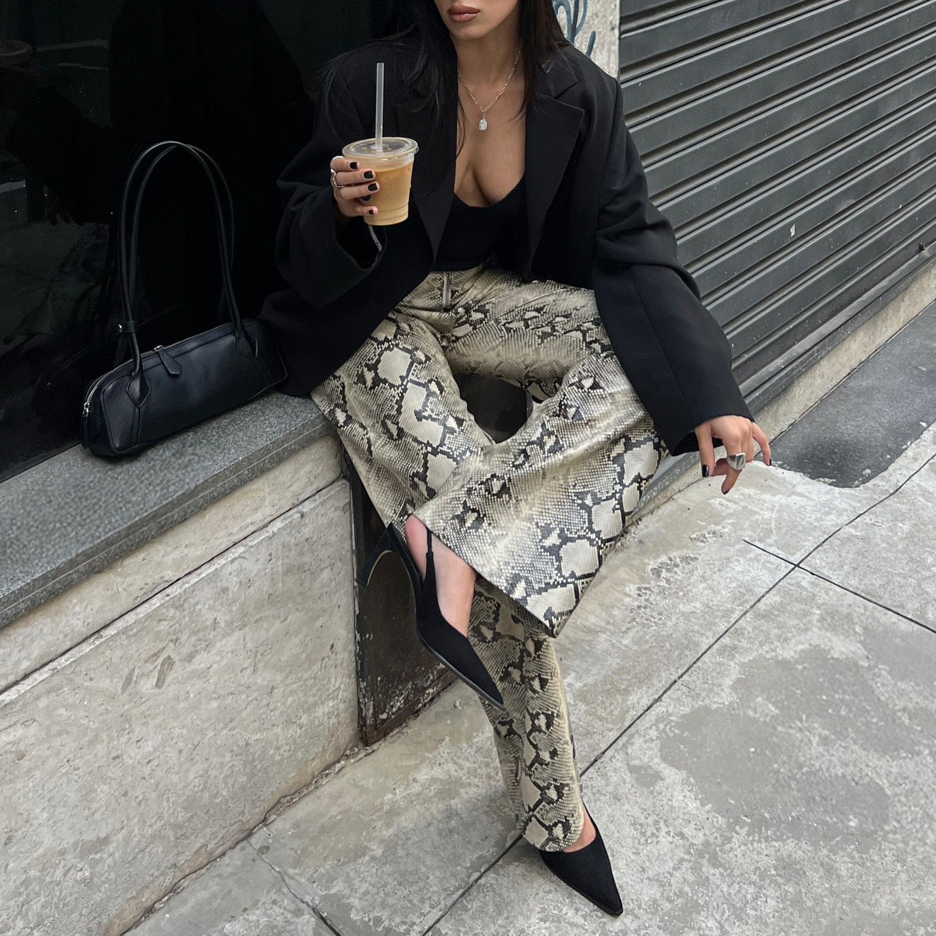Elegant woman snake print pants Chic and Style