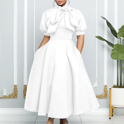 Robe midi femme avec un élégant noeud et des manches bouffantes Chic und Stil