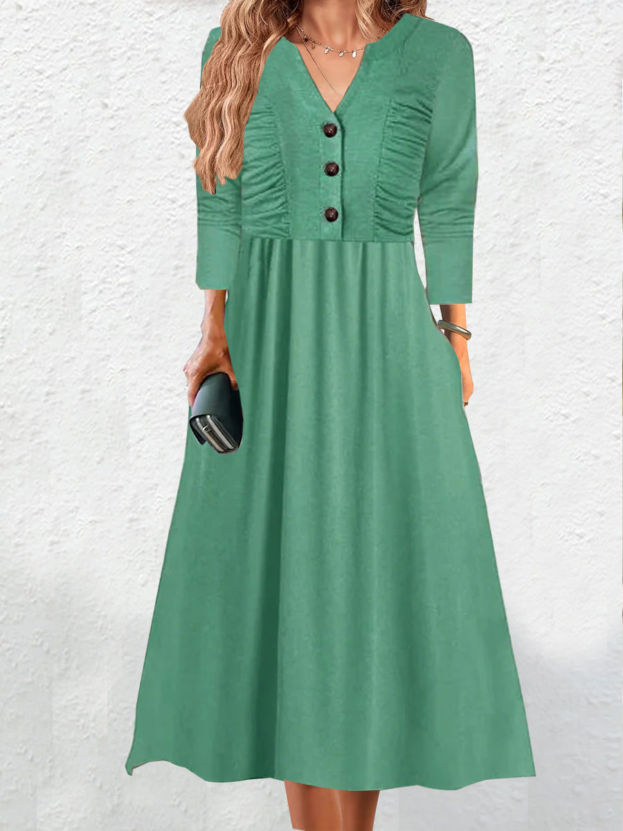 Robe midi femme avec élégant décolleté en V et détails de boutons Chic und Stil