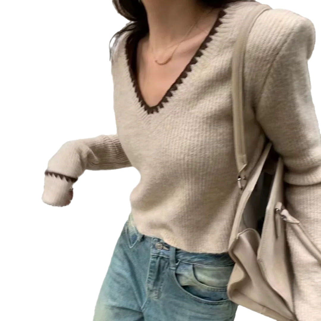 Pull en tricot à col V pour dames avec finitions décoratives Chic und Stil