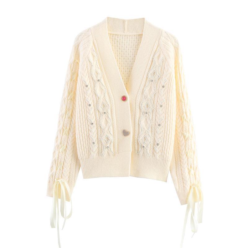 Knitted jacket for women with a detailed textured pattern and elegant ruffle details Chic and Style