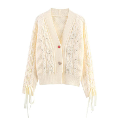 Knitted jacket for women with a detailed textured pattern and elegant ruffle details Chic and Style