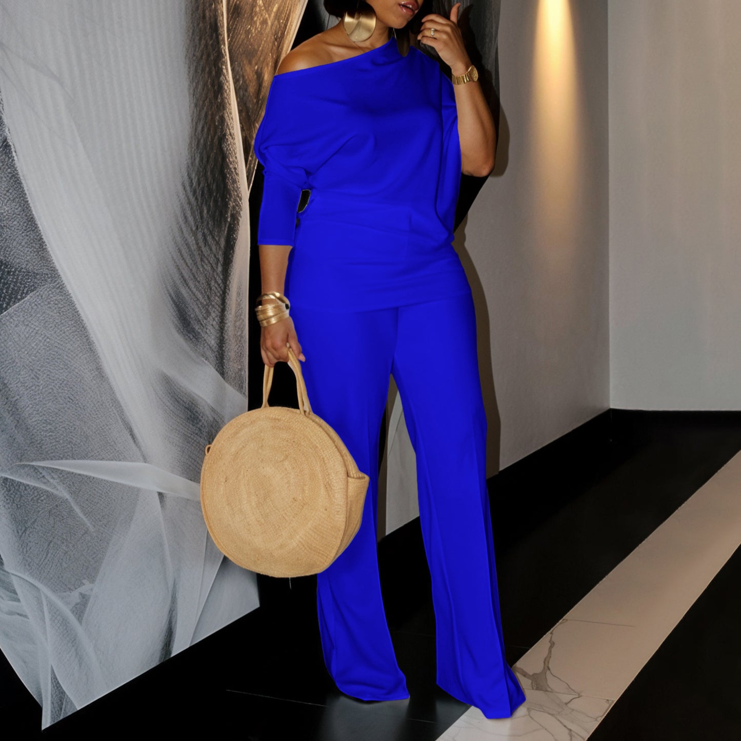 Woman Elegant set with a beautiful one-shoulder top and wide pants Chic and Style