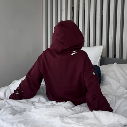 Pull à capuche oversize pour femmes avec des détails de déchirure tendance Chic und Stil