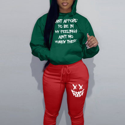 Casual women’s outfit with hoodie and jogger pants, featuring unique writing and creative patterns Chic and Style