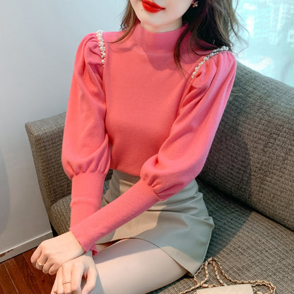 Pull élégant pour femmes avec des manches bouffantes et des détails en perles Chic und Stil