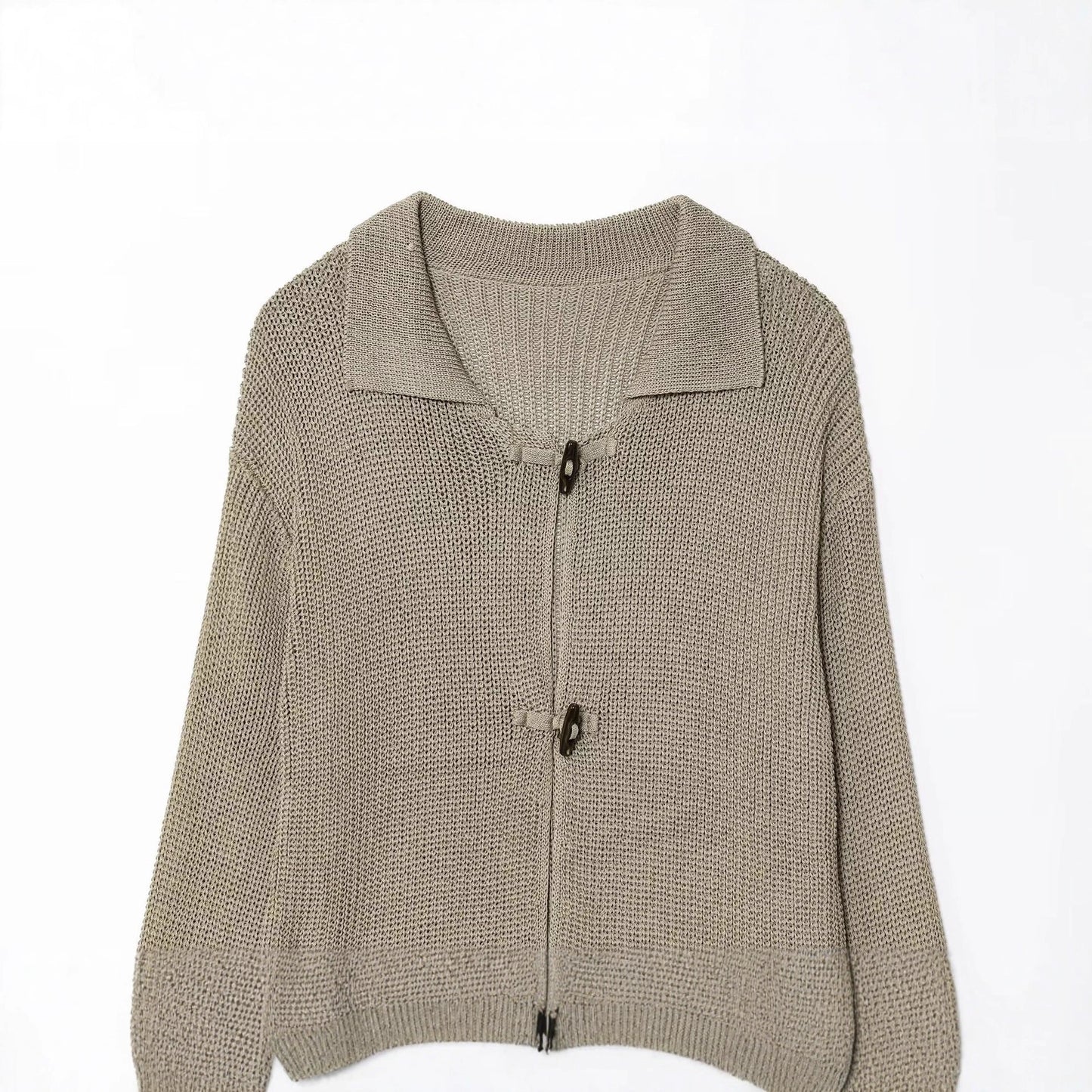Women's knit jacket with elegant buttons and textured surface Chic und Stil