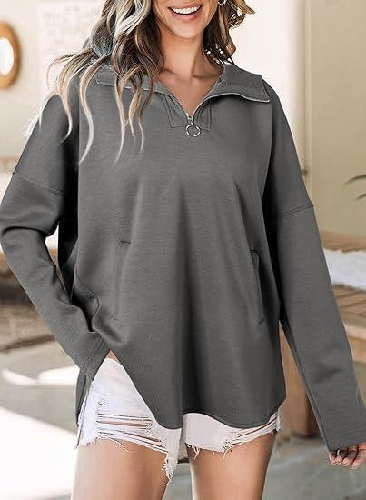 Pull en gros classique pour femmes avec demi-fermeture éclair et poches latérales Chic und Stil