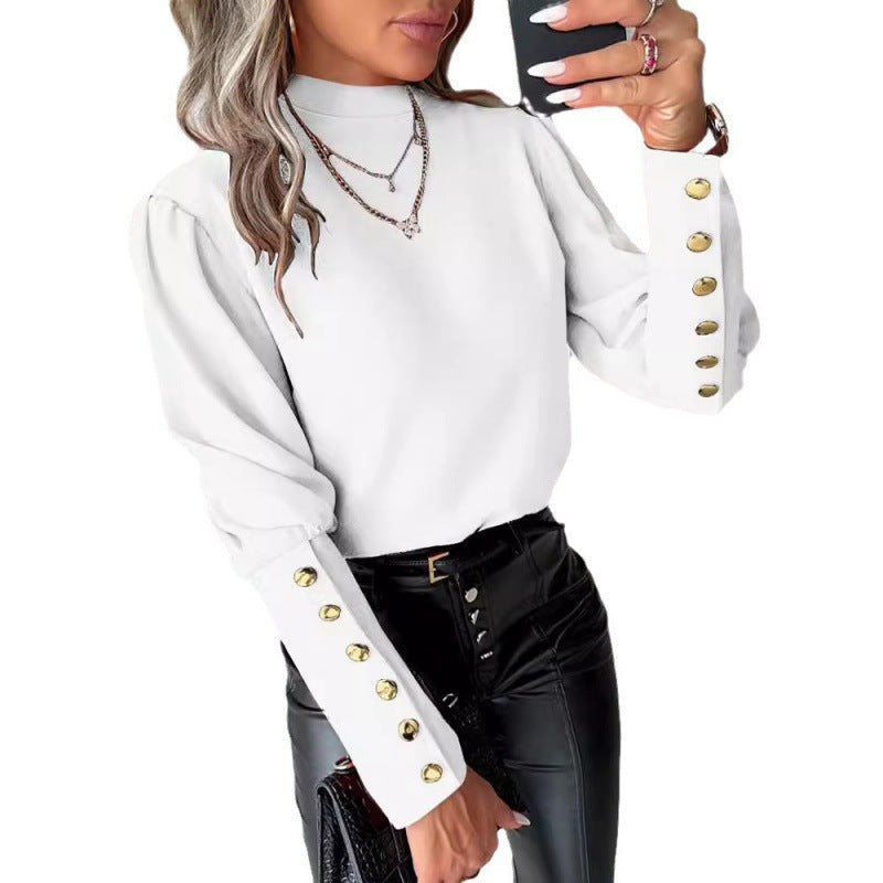 Blouse élégante pour femmes avec des manches bouffantes et des détails de boutons dorés Chic und Stil