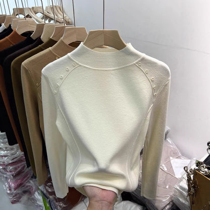 Pull élégant pour femmes avec détails de boutons et col haut Chic und Stil
