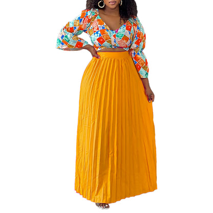 Robe combinée plissée pour dames avec un haut coloré et une jupe évasée Chic und Stil