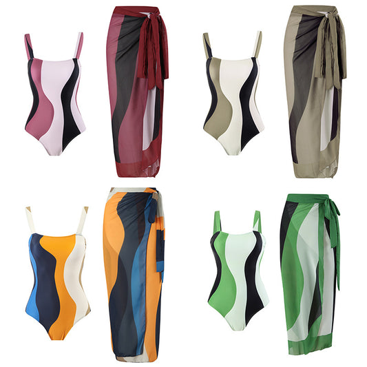 Maillot de bain une pièce pour femmes avec jupe portefeuille à la mode et motif à vagues graphiques Chic und Stil