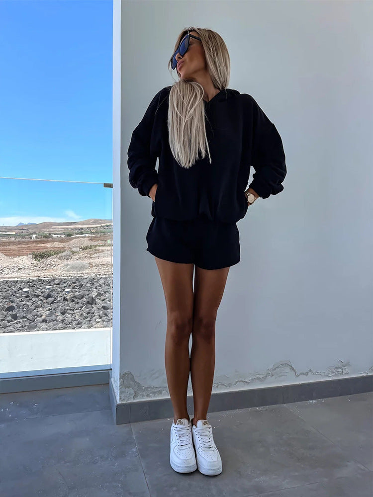 Fashionable women's set consisting of a comfortable hoodie and chic shorts