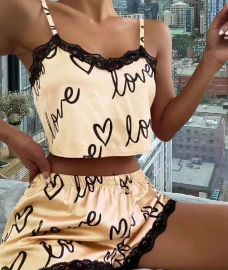 Chic and Style women's satin crop top and shorts set with hearts and lace accents