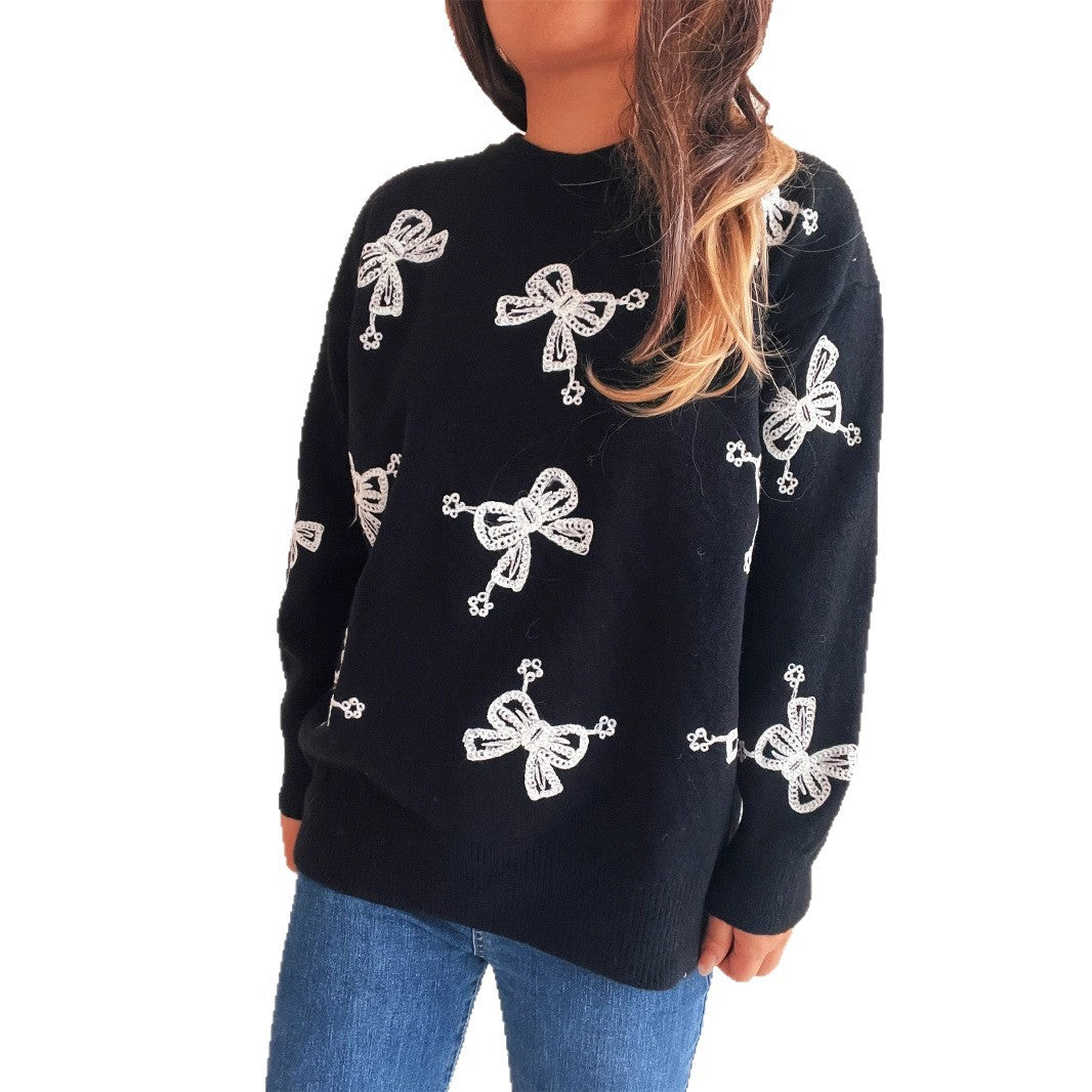 Pull femme avec motif de nœud ludique et coupe décontractée Chic und Stil