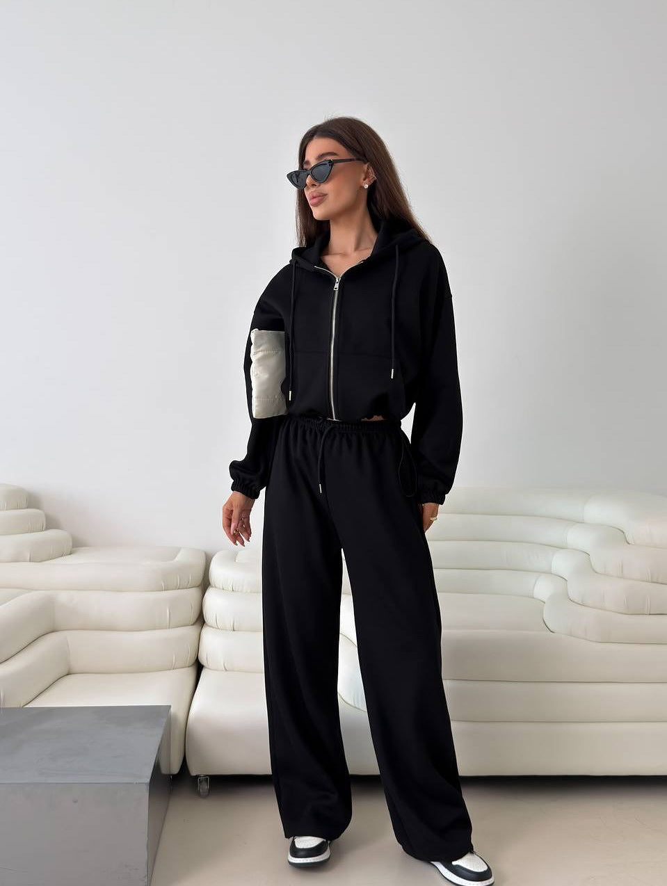 Fashionable women's hoodie with a short cut and matching jogger pants Chic and Style