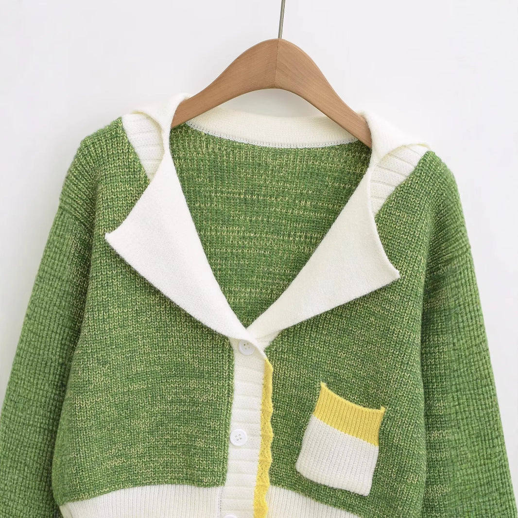 Ladies comfortable knit pullover with an elegant shawl collar and contrasting pockets Chic and Style