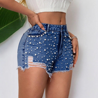 Shorts en denim pour femmes avec décoration en perles et ourlet effiloché Chic und Stil