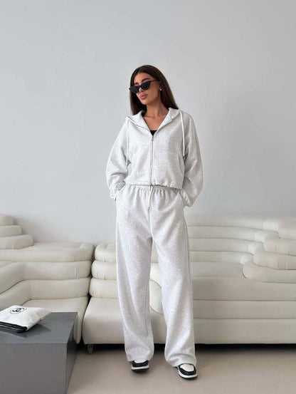 Fashionable women's hoodie with a short cut and matching jogger pants Chic and Style