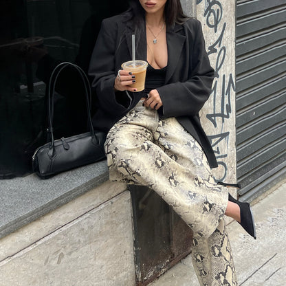 Elegant woman snake print pants Chic and Style