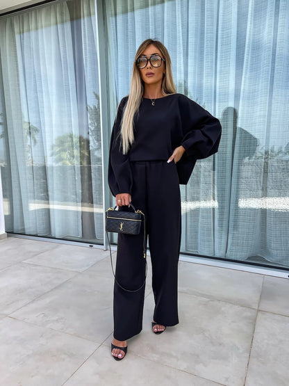 Elegant and modern women's two-piece set with a loose top and chic palazzo pants.