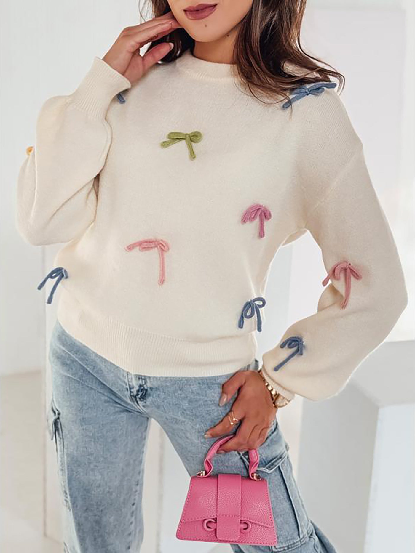 Pull en tricot pour femmes avec des appliques de nœuds ludiques et une coupe décontractée Chic und Stil