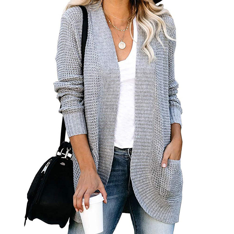 Veste en tricot pour femmes avec un motif de tricot moderne et des poches pratiques Chic und Stil