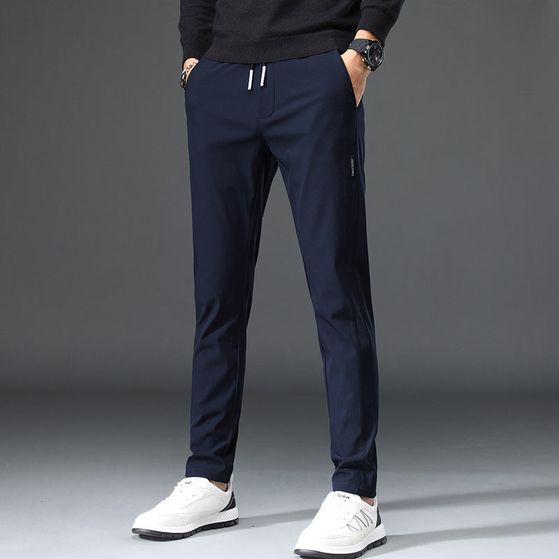 Men's slim fit sports pants with elastic waistband and practical zip pockets Chic and Style