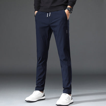 Men's slim fit sports pants with elastic waistband and practical zip pockets Chic and Style