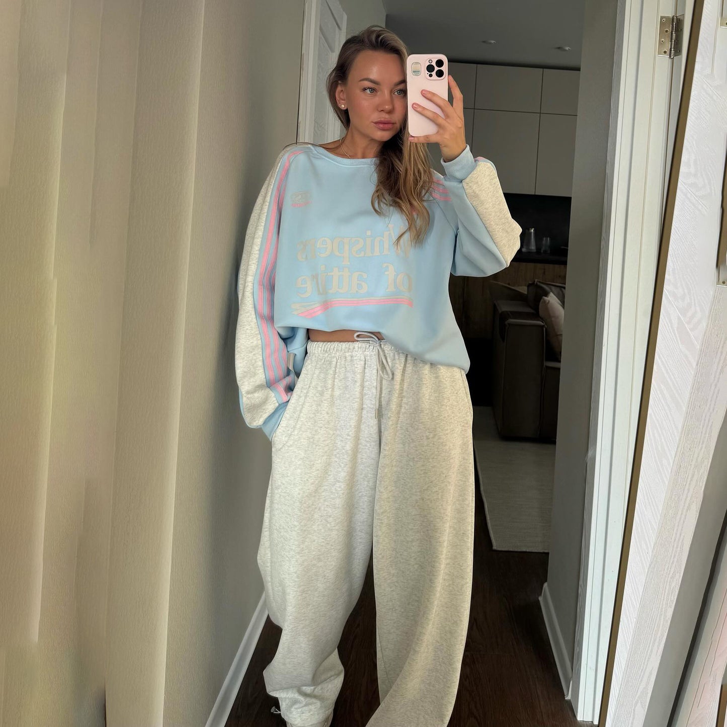 Ladies Casual Sports Outfit with a Relaxed Sweatshirt and Comfortable Jogging Pants Chic and Style