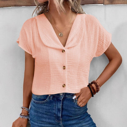 Chemisier féminin avec un col châle élégant et des détails de bouton décoratifs Chic und Stil