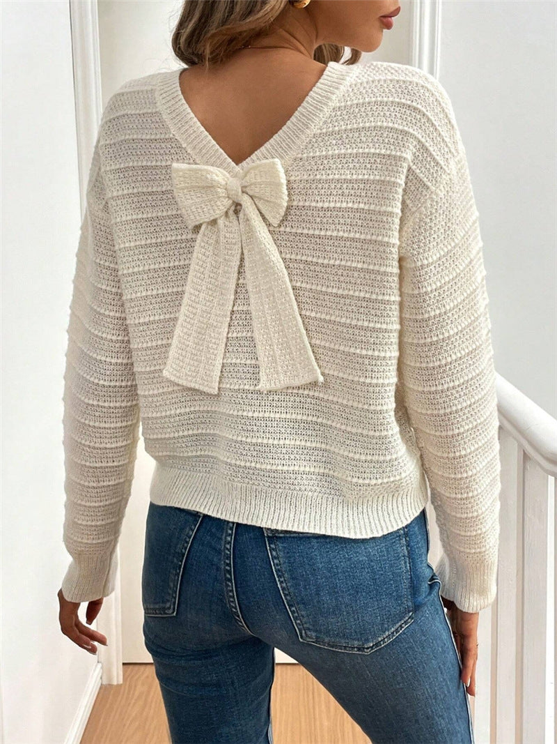 Pull femme en tricot à col en V avec élément décoratif de nœud Chic und Stil