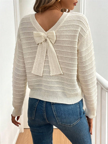 Pull femme en tricot à col en V avec élément décoratif de nœud Chic und Stil