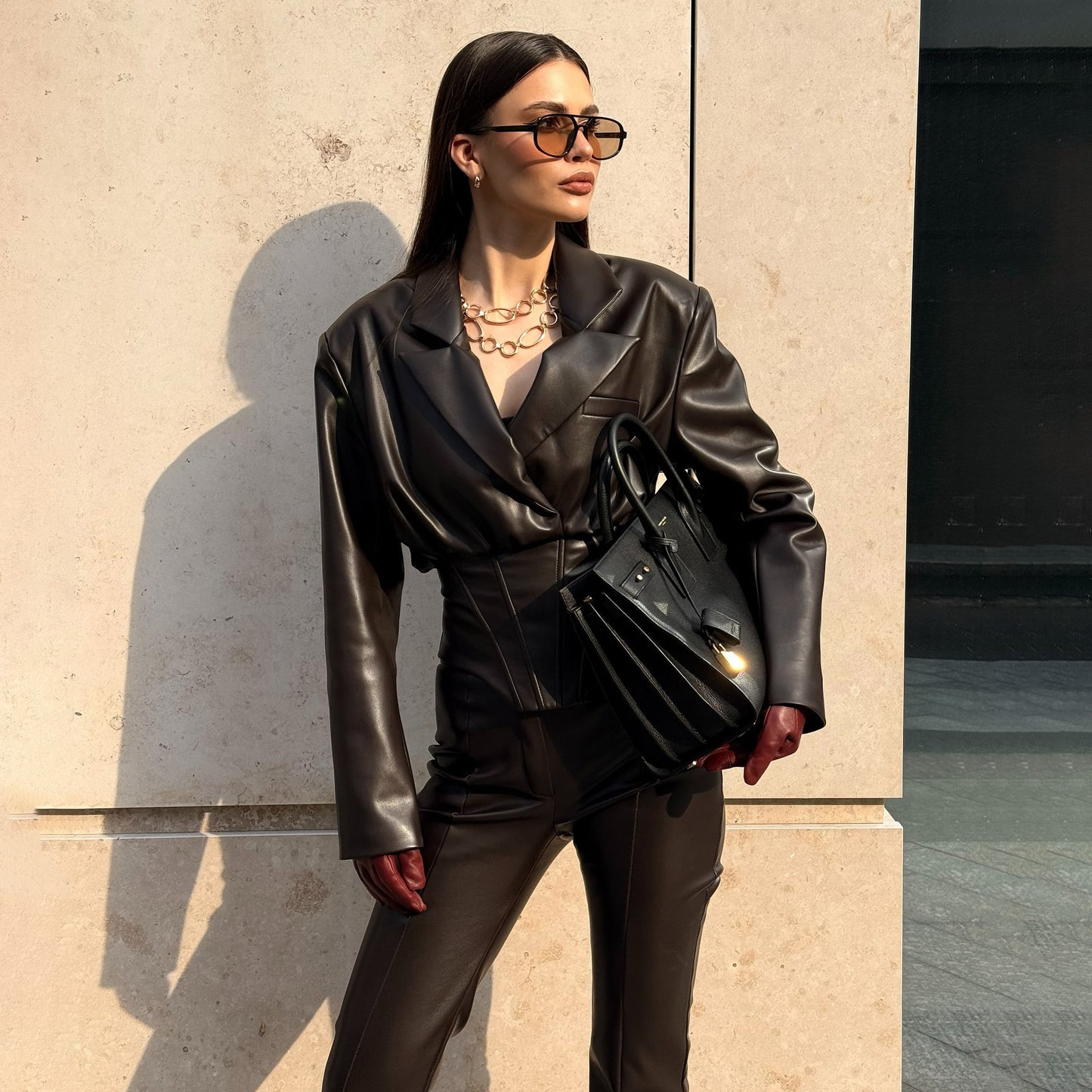 Elegant leather jacket for women with trendy blazer and slim pants