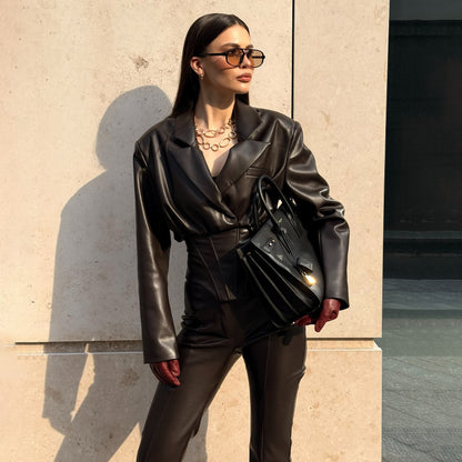 Elegant leather jacket for women with trendy blazer and slim pants
