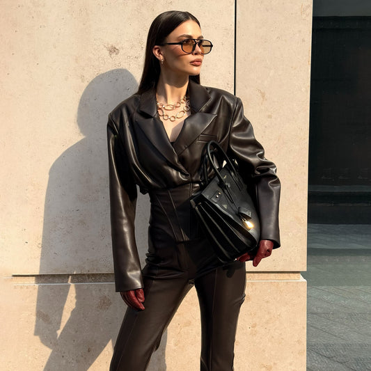 Elegant leather jacket for women with trendy blazer and slim pants