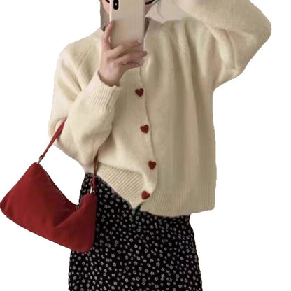 Dames pull-over tricot doux avec boutons en forme de cœur Chic und Stil