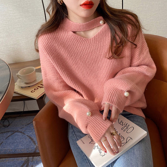 Pull en tricot pour femmes avec un look cut-out raffiné et des manches ornées de perles Chic und Stil