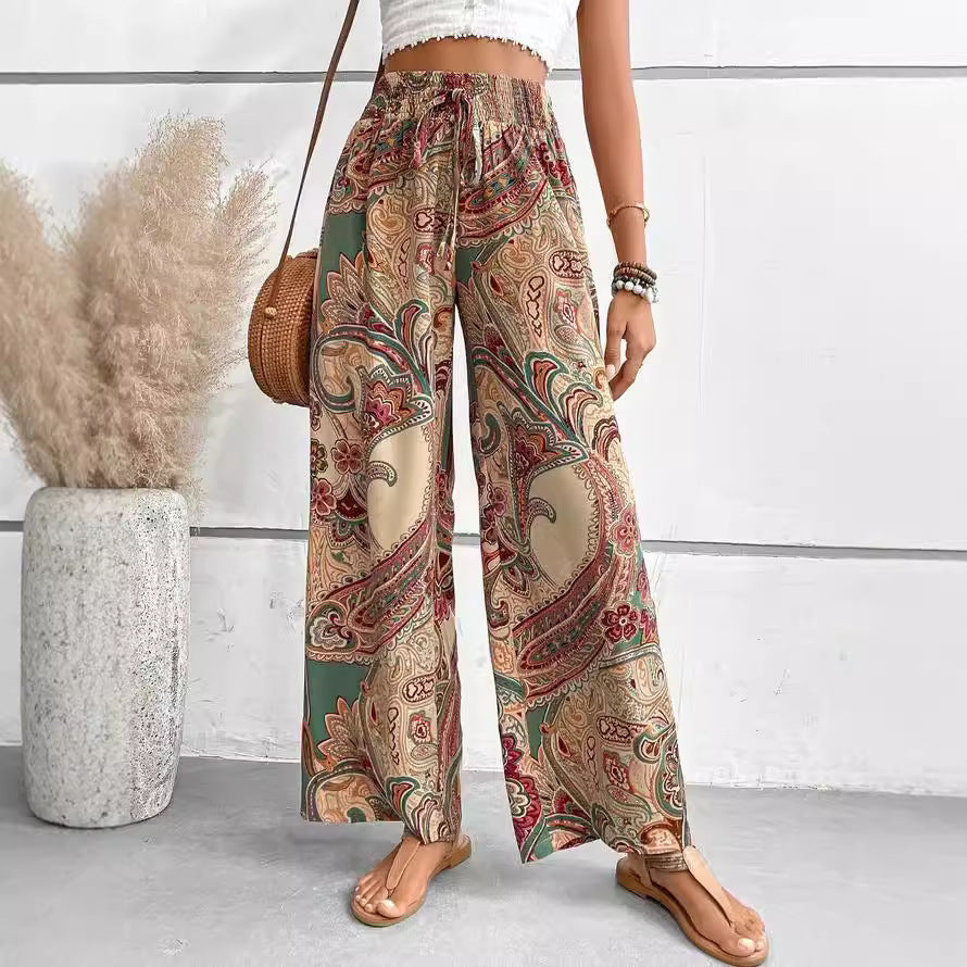 Wide palazzo pants for women with a colorful paisley pattern and an elastic waistband Chic und Stil