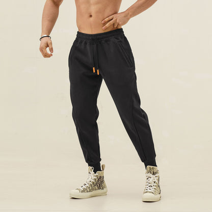 Sporty jogger pants for men with elastic waistband and stylish contrasting stripes Chic und Stil