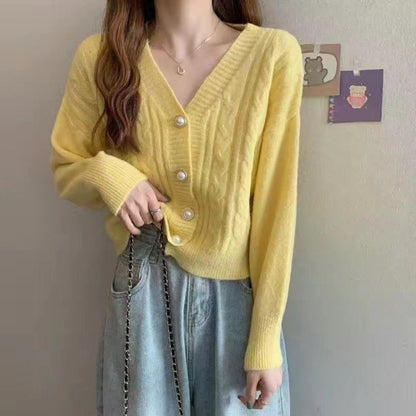 Knitted jacket for women with an elegant braid pattern and high-quality button details Chic and Style