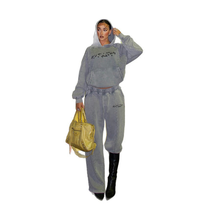Dames Urbanes Freizeitanzug mit Kapuzenpullover und weiten Hosen Chic und Stil