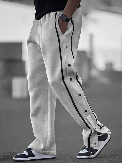 Stylish men's sports pants with snap button details and side pockets Chic and Style