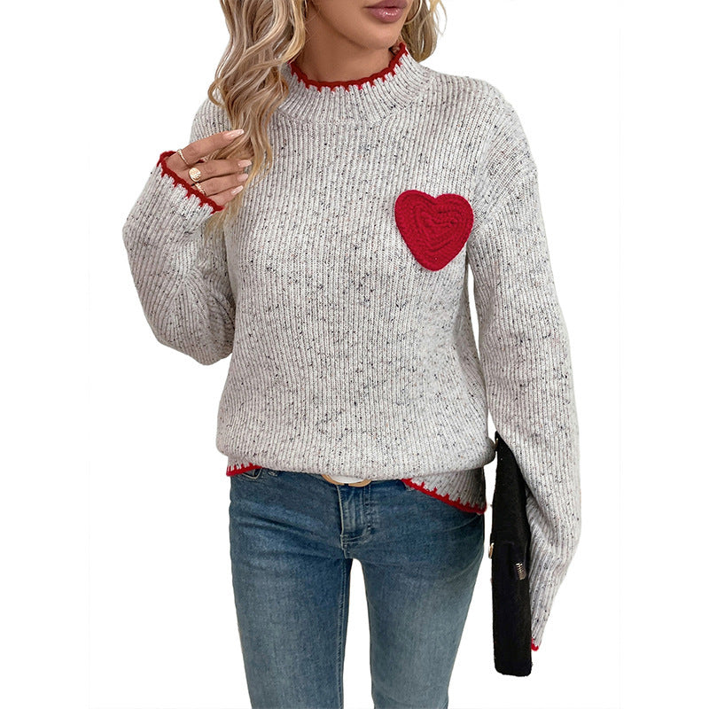 Pull-over en tricot pour femmes avec application en forme de cœur et ourlet décoratif Chic und Stil