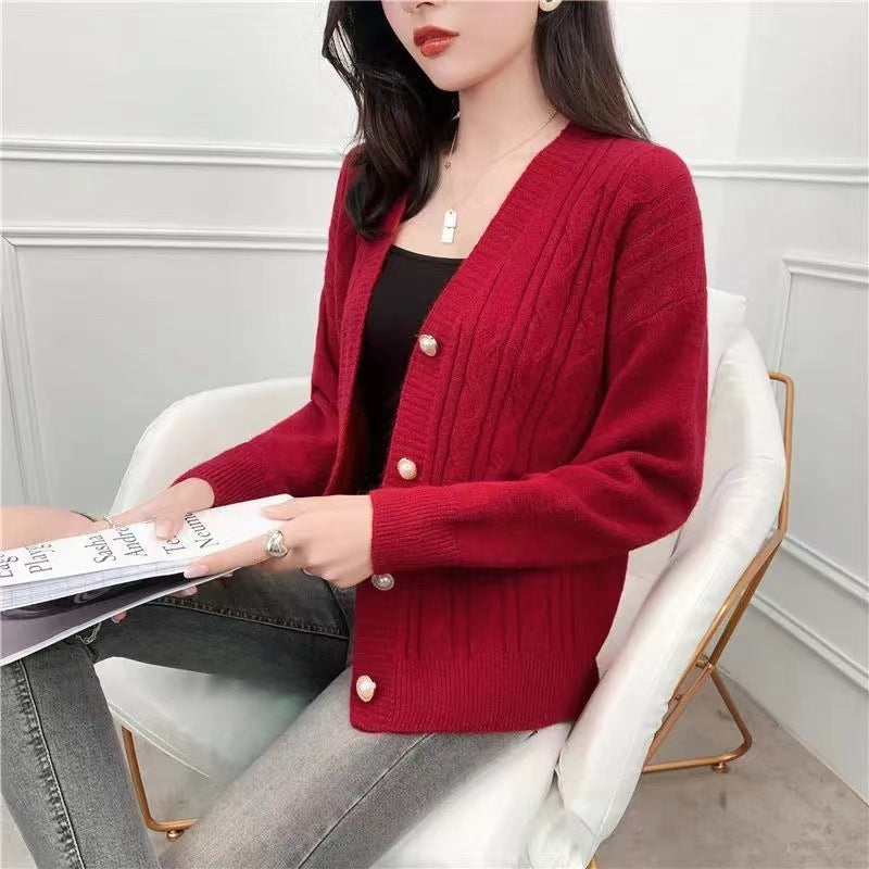 Knitted jacket for women with an elegant braid pattern and high-quality button details Chic and Style