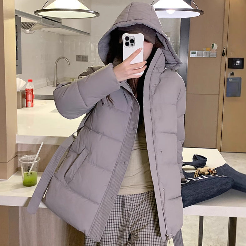 Classic women's down jacket with high collar and practical pockets. Chic and stylish.