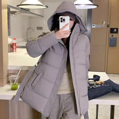 Classic women's down jacket with high collar and practical pockets. Chic and stylish.