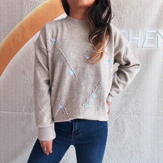 Pull femme avec des détails en perles et en strass à la mode Chic und Stil